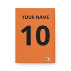 Soccer Journal — "One Game One World" Hardcover Notebook (Custom Name & Number)